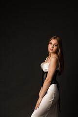 Young woman in a long dress with a corset on top