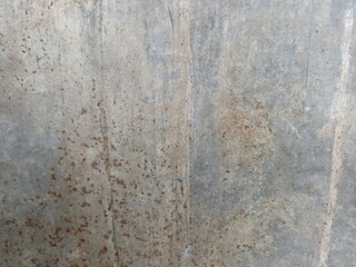Weathered Concrete Wall Texture. Close-up of aged concrete wall with natural stains and rough texture, ideal for backgrounds and architectural design