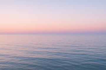 Obraz premium Serene Ocean Horizon at Sunset with Soft Pastel Colors, Calm Water, and Beautiful Sky