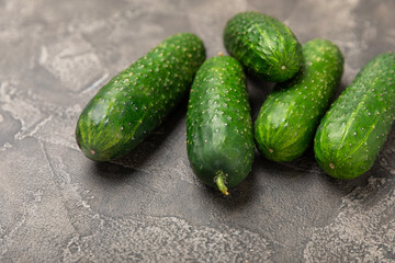 Cucumber on wooden background. Slice of cucumber on background. Fresh organic green cucumbers...