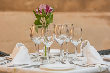 Typical European sidewalk restaurant scene with elegant table setting