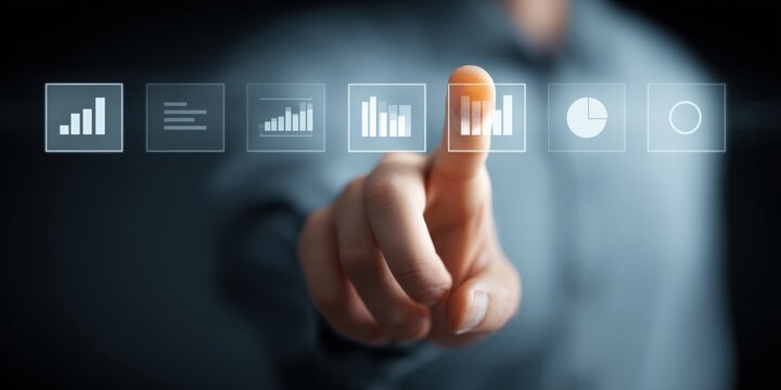 Human finger presses business analytics interface button, displaying data visualization and digital transformation.