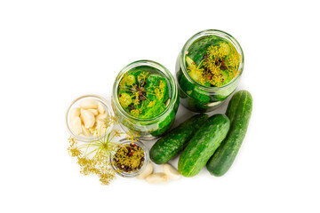 Freshly-salted homemade cucumbers in a jar isolated on white background. canned cucumbers.cucumbers and dill.Recipe of homemade preservations.fermented veggies.