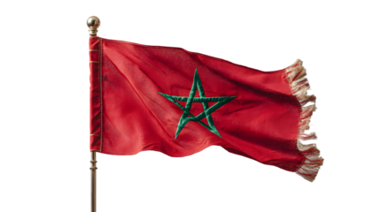 A vibrant red moroccan flag waving against a dark background with a green star emblem and fringe detail