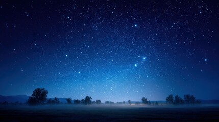 Fototapeta premium Night Sky with Stars Over Misty Landscape - Captivating Scene of Nature's Beauty