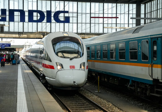An incoming ICE (Intercity Express) train at Munich Central Station, the largest railroad junction in Bavaria. Another train on a parallel track