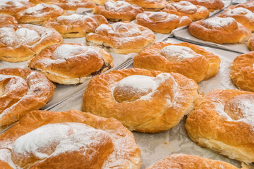 Traditional Majorcan ensaimadas pastries dusted with sugar at Palma market