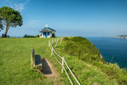 Picturesque Ermita de la Regalina on the steep cliffs in Asturias, Spain