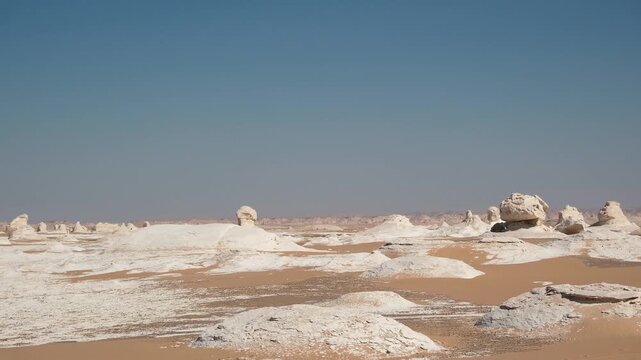 White rock formations and sand dunes in Egypt's White Desert, natural desert landscape	