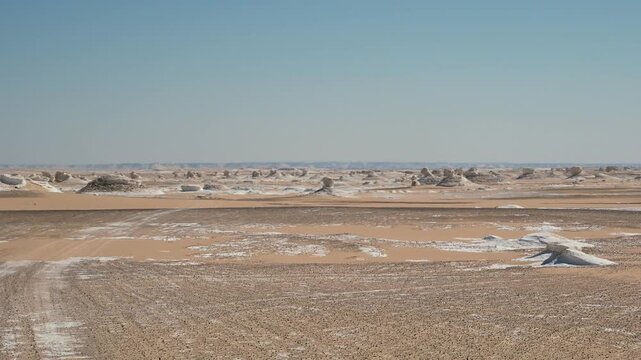 White rock formations and sand dunes in Egypt's White Desert, natural desert landscape	
