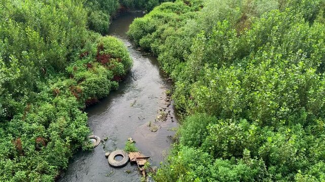 The dried up Dnieper River. The global problem of water waste. The river polluted with waste and garbage.