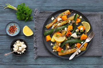 roasted vegetable salad with goat cheese on plate