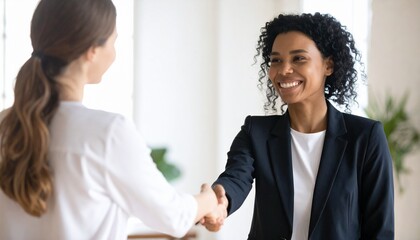 Portrait of Cheerful Young Manager Handshake with New Employee