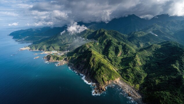 Coastal mountain range, lush greenery, dramatic clouds