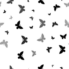 Seamless vector pattern with butterfly symbols, creating a creative monochrome background with rotated elements. Illustration on transparent background