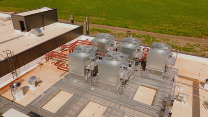 Industrial air conditioning units cooling a building on rooftop