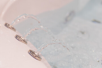 Water jets in a spa bath creating soothing ambiance with bubbles and relaxation features