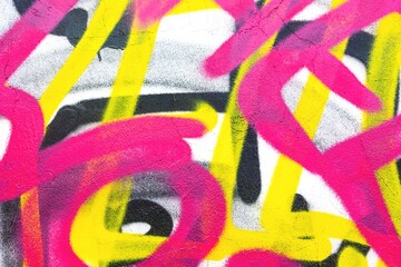 Vibrant graffiti with neon pink and yellow on textured wall. Urban 90s, colorful street art, funky vibes. Posters, backgrounds, creative media, modern 90s design.