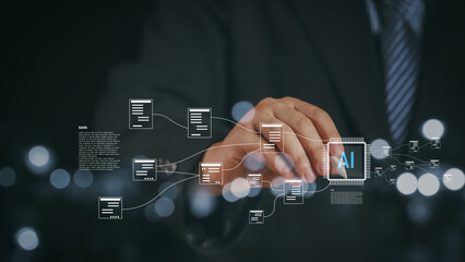 Businessman working with AI chip interface and big data flow structure. Concept for artificial intelligence, data processing, automation, innovation, and digital transformation.