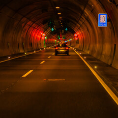 Driving through a tunnel, long exposure, blur, light trails.
german autobahn romantic, blurry.
on...