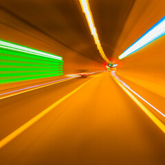 Driving through a tunnel, long exposure, blur, light trails.
german autobahn romantic, blurry.
on...