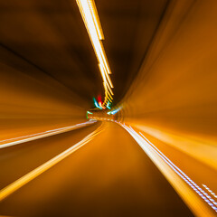 Driving through a tunnel, long exposure, blur, light trails.
german autobahn romantic, blurry.
on...