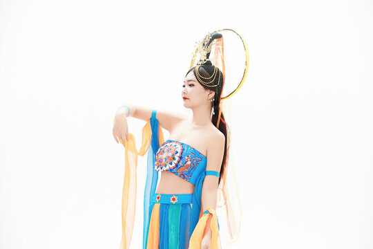 Chinese girls dressed in Tang Dynasty Dunhuang costumes dancing the flying apsaras dance
