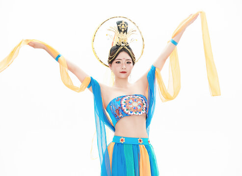 Chinese girls dressed in Tang Dynasty Dunhuang costumes dancing the flying apsaras dance