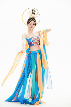 Chinese girls dressed in Tang Dynasty Dunhuang costumes dancing the flying apsaras dance