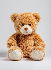 Obraz premium A cuddly, plush teddy bear sits patiently, its soft fur and endearing features creating a sense of comfort and warmth.