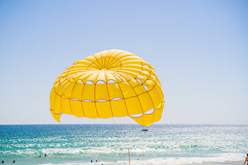 Parasailing on the beach at Phuket Thailand.