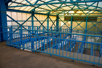 Pedestrian bridge over road with winding ramp