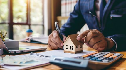 Real estate agents calculate mortgage loans and financing plans for clients.