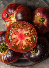 black prince tomatoes on a dark background
