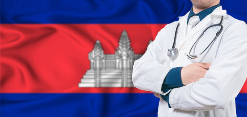 Cambodia healthcare concept. Male doctor on Cambodia flag. Doctor with crossed arms on Cambodia flag