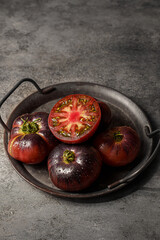 black prince tomatoes on a dark background