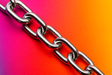 Obraz premium Close-up of silver chain on vibrant background, stylish commercial fashion theme