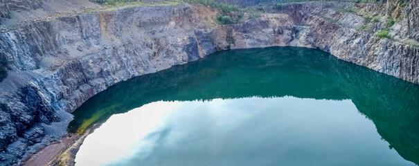 Lake in siderite quarry Siderite and crushed stone mining