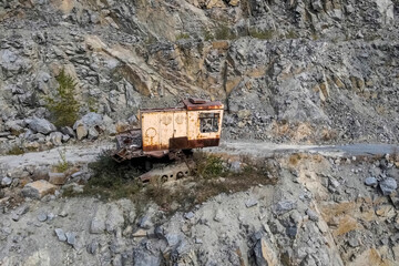 old abandoned building of a mining excavator on one of the slope