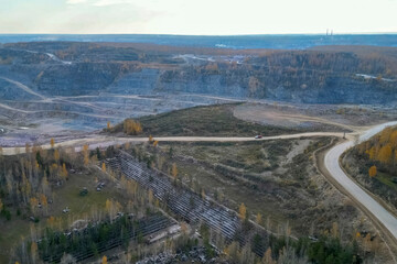 old marble quarry overgrown with trees.