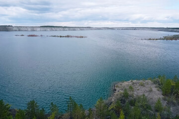 large lake in the pit of an old quarry.