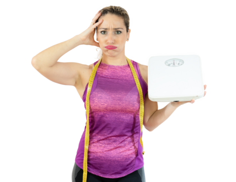Middle aged sport woman holding bathroom scales with worried expression over transparent background
