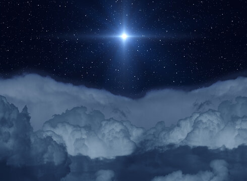 Star of Jesus above the clouds in the night sky