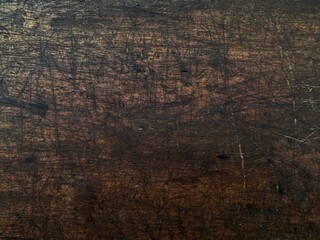 Distressed brown wood texture as background. Scratched vintage wooden surface background.