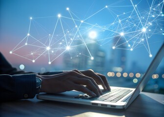 A person working on a laptop computer with a digital network connection overlaid against a cityscape at dusk creating a technology concept.