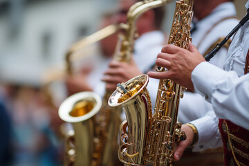 Obraz premium Traditional brass band performing on stage at Oktoberfest, close-up of instruments and costumes, 