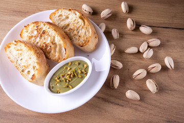 pistachio spread with bread on plate