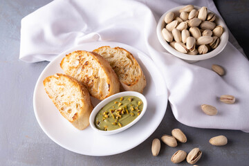pistachio spread with bread on plate