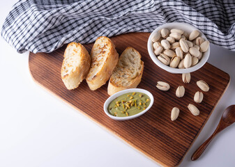 pistachio spread with bread on board