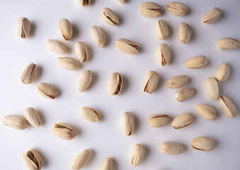 salted pistachios on a white background